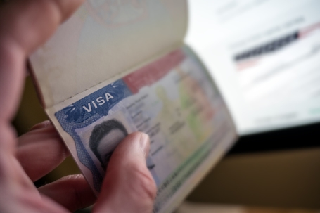 person holding a US visa
