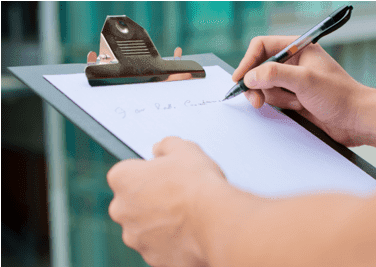 signing application on a clipboard