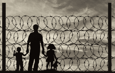 family behind barbed wire
